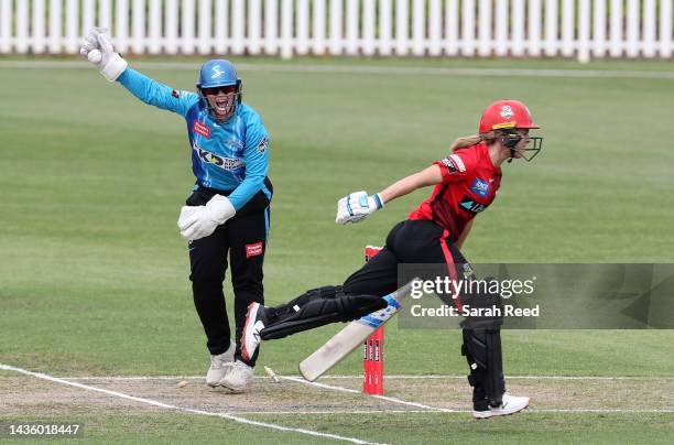 Sophie Molineux of the Melbourne Renegades run out for 1 run from a Megan Schutt of the Adelaide Strikers throw. Tegan McPharlin of the Adelaide...