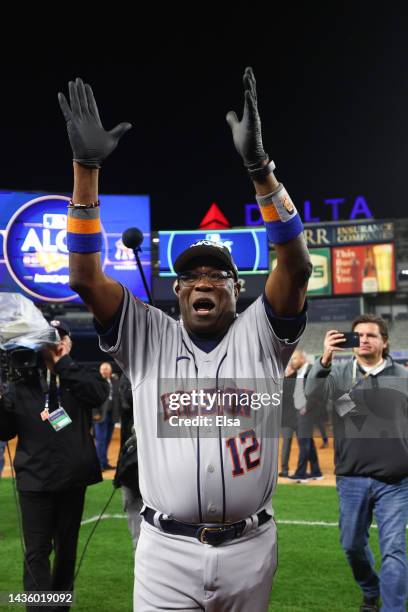 Manager Dusty Baker Jr. #12 of the Houston Astros celebrates after winning game four of the American League Championship Series against the New York...