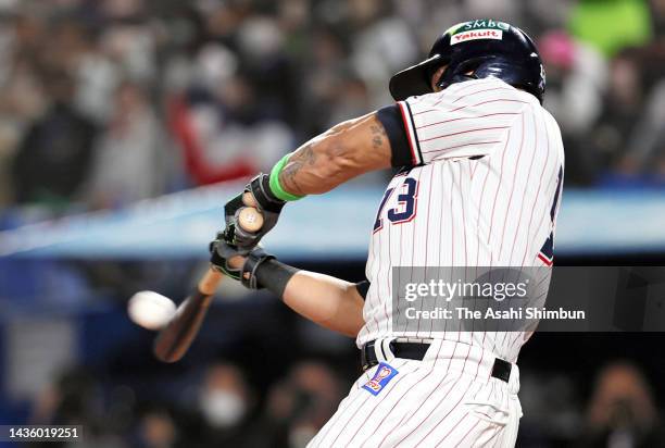 Jose Osuna of the Yakult Swallows hits a solo home run in the 4th inning against Orix Buffaloes during the Japan Series Game One at Jingu Stadium on...