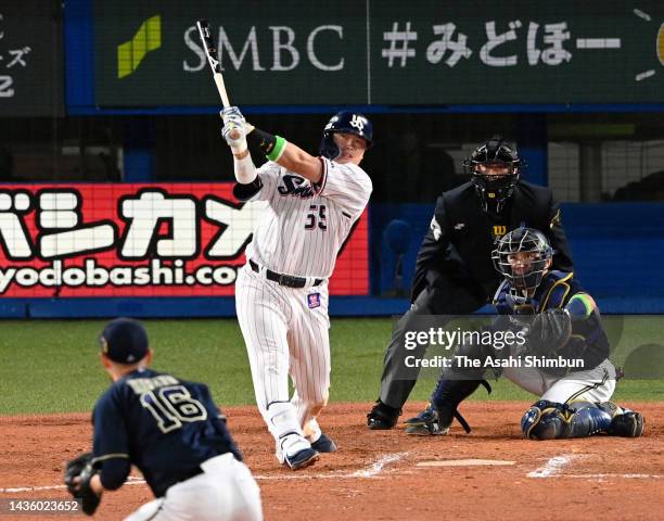 Munetaka Murakami of the Yakult Swallows hits a solo home run in the 8th inning against Orix Buffaloes during the Japan Series Game One at Jingu...