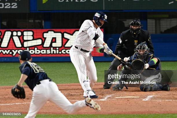 Munetaka Murakami of the Yakult Swallows hits a solo home run in the 8th inning against Orix Buffaloes during the Japan Series Game One at Jingu...