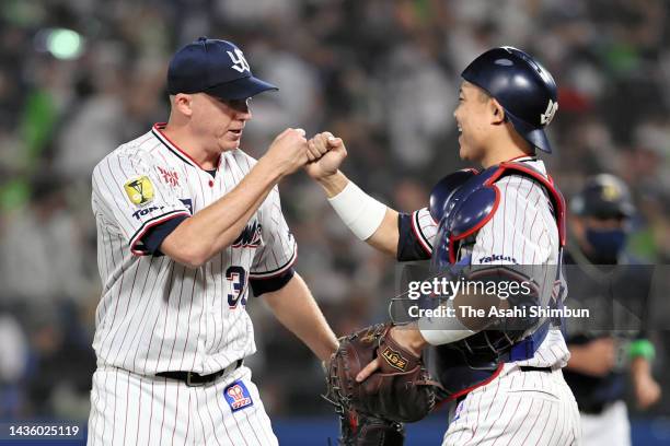 Scott McGough and Yuhei Nakamura of the Yakult Swallows celebrate winning against Orix Buffaloes in the Japan Series Game One at Jingu Stadium on...