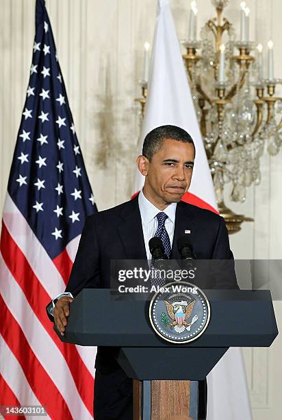 President Barack Obama pauses during a news conference with Japanese Prime Minister Yoshihiko Noda at the East Room of the White House April 30, 2012...