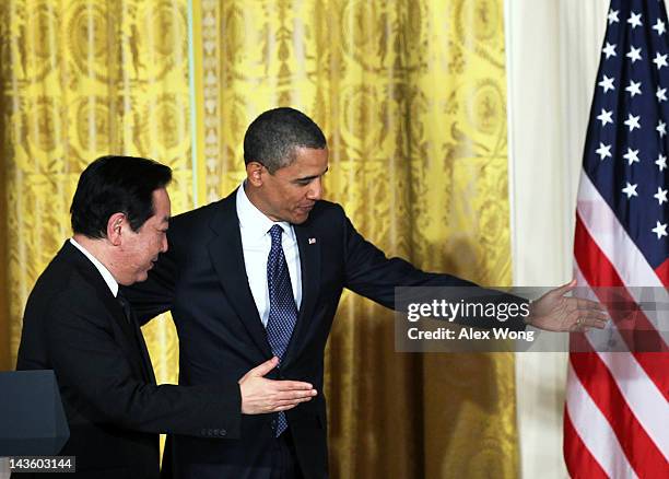 President Barack Obama and Japanese Prime Minister Yoshihiko Noda leave after a press conference at the East Room of the White House April 30, 2012...