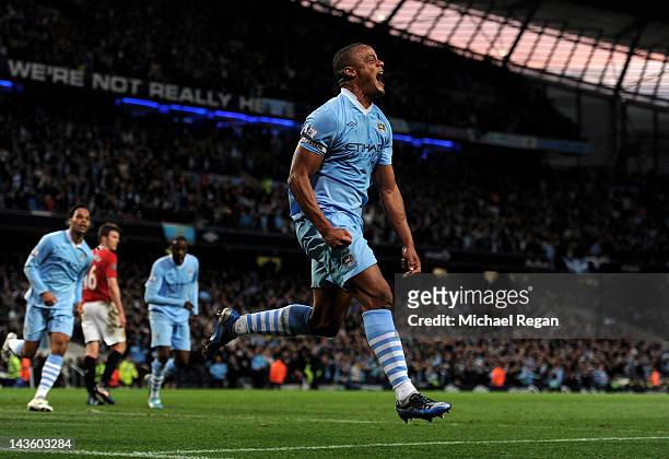 Vincent Kompany of Manchester City celebrates scoring the opening goal during the Barclays Premier League match between Manchester City and...