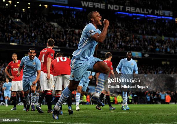 Vincent Kompany of Manchester City celebrates scoring the opening goal during the Barclays Premier League match between Manchester City and...