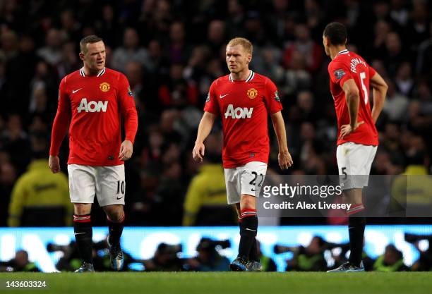 Wayne Rooney , Paul Scholes and Rio Ferdinand of Manchester United react after conceding the opening goal during the Barclays Premier League match...