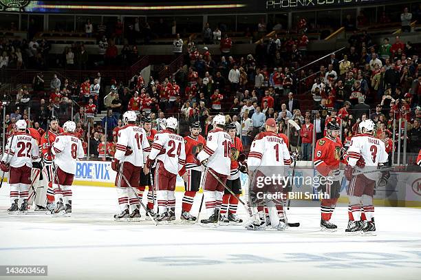 The Chicago Blackhawks and the Phoenix Coyotes shake hands after the Coyotes won the Western Conference Quarterfinals against the Blackhawks during...