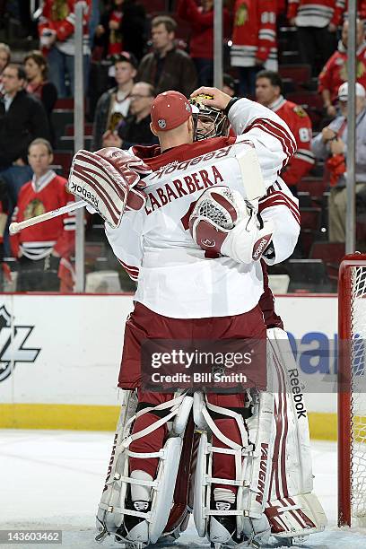 Goalies Mike Smith and Jason Labarbera of the Phoenix Coyotes celebrate after winning the Western Conference Quarterfinals against the Chicago...