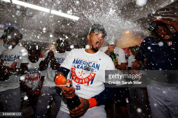Martin Maldonado of the Houston Astros celebrates with manager Dusty Baker in the locker room after defeating the New York Yankees 6-5 in game four...