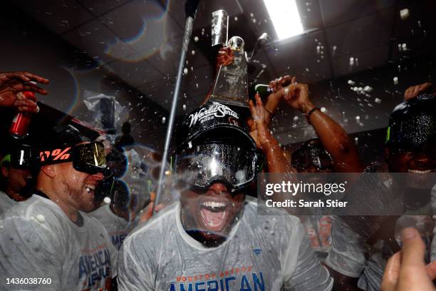 Hector Neris and Christian Vazquez of the Houston Astros celebrate in the locker room after defeating the New York Yankees 6-5 in game four of the...