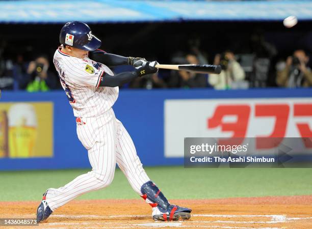 Soma Uchiyama of the Yakult Swallows hits a three-run home run in the 9th inning against Orix Buffaloes during the Japan Series Game Two at Jingu...