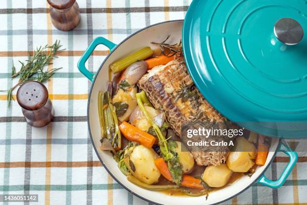 pork roast with vegetables - dutch oven stock pictures, royalty-free photos & images