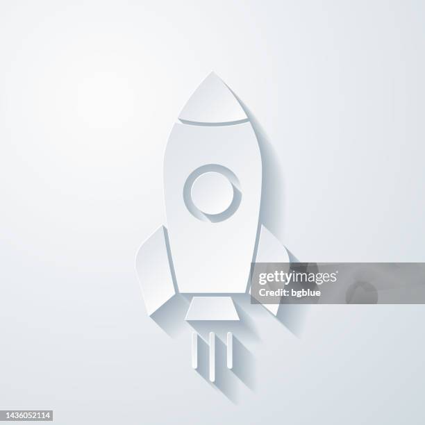 rakete. symbol mit scherenschnitteffekt auf leerem hintergrund - boat launch stock-grafiken, -clipart, -cartoons und -symbole