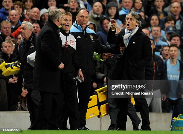 Manchester United Manager Sir Alex Ferguson clashes with Manchester City Manager Roberto Mancini during the Barclays Premier League match between...