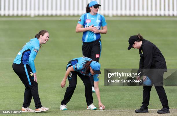 Amanda-Jade Wellington of the Adelaide Strikers and Megan Schutt of the Adelaide Strikers has a laugh with Umpire Eloise Sheridan during the Women's...