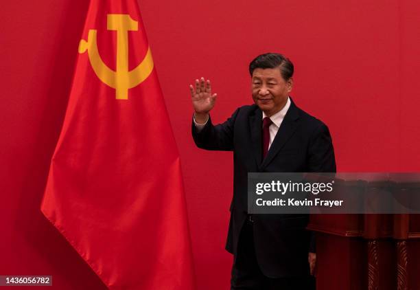 General Secretary and Chinese President Xi Jinping waves as he leaves after speaking at a press event with Members of the new Standing Committee of...