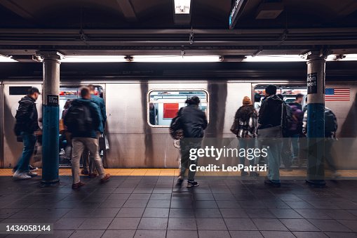 Crowd of people in a NYC subway station waiting for the train Crowd of people in a NYC subway station waiting for the train