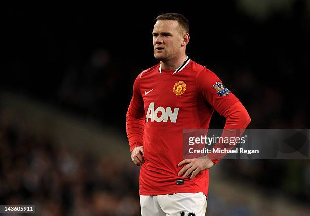 Wayne Rooney of Manchester United looks dejected at the end of the Barclays Premier League match between Manchester City and Manchester United at the...