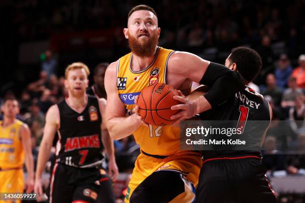 Aron Baynes of the Bullets drives the ball to the basket during the round four NBL match between Illawarra Hawks and Brisbane Bullets at WIN...