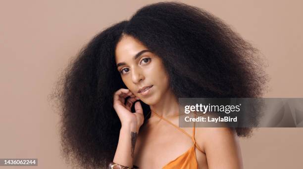 black woman afro, beauty and hair for salon fashion style against a mockup studio background. portrait of a beautiful happy african american female model with curly, frizzy or stylish hairdo - frizzy hair stock pictures, royalty-free photos & images