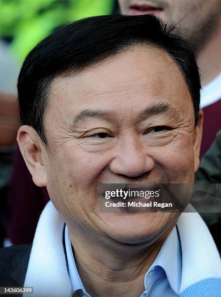 Ex Manchester City owner Thaksin Shinawatra looks on from the crowd prior to the Barclays Premier League match between Manchester City and Manchester...