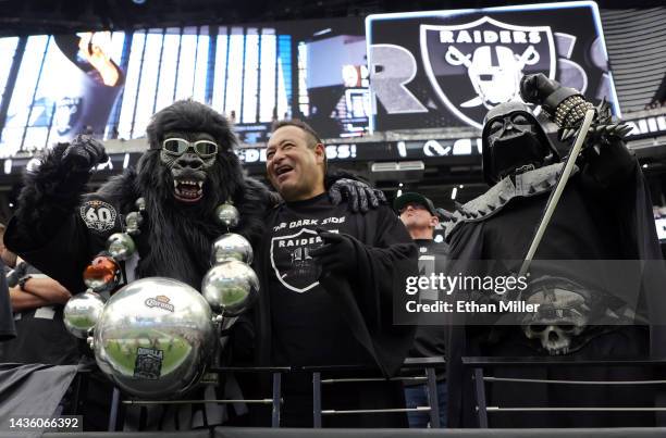 Las Vegas Raiders fans Mark "Gorilla Rilla" Acasio, Leonard "Raider Sith" Ybarra and his brother, Charles "Darth Raider" Ybarra, all of California,...