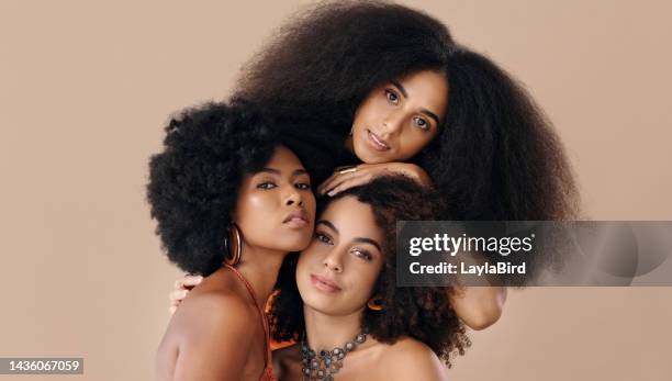 beauty, group and portrait of african women with natural hair in studio for sisterhood, community and culture. young black friends with afro for feminism, empowerment and unity by brown background. - backgrounds people imagens e fotografias de stock