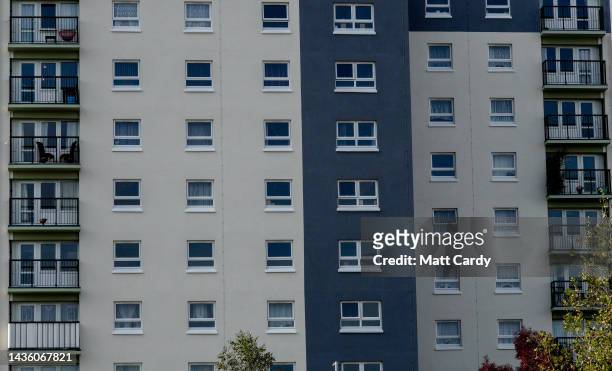 Windows in a tower block style high-rise block of flats overlook a housing estate, on October 18, 2022 in Bristol, England. The UK is currently...