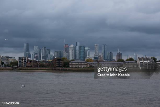 General view across the Thames river of Canary Wharf on an overcast day from Greenwich on October 23, 2022 in London, England.