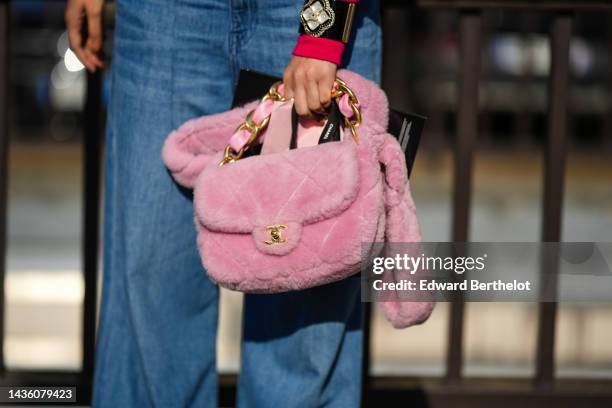 Guest wears a neon pink and red buttoned wool cropped cardigan, pale blue denim wide legs pants, a black shiny leather with embroidered large crystal...