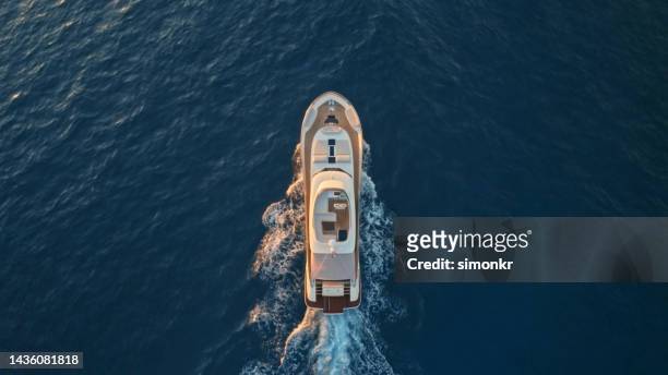 modern yacht cruising in sea - yacht top view stock pictures, royalty-free photos & images