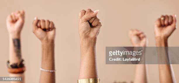 solidarity, fight and protest women fists hand sign for empowerment, support or community on studio beige background. diversity, collaboration and teamwork people hands icon for commitment and trust - muscle black wallpaper stock pictures, royalty-free photos & images