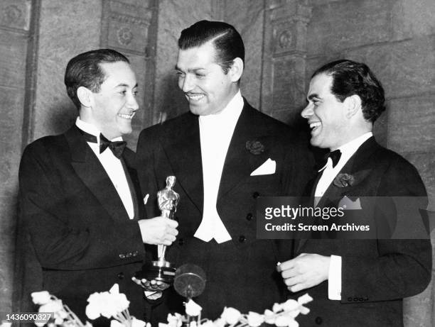 Clark Gable, Irving Thalberg and Frank Capra at the Academy Awards, 1935. .