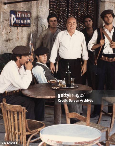Al Pacino, Franco Citti, Saro Urzi and Angelo Infanti at Bar Vitelli in a scene from the Francis Ford Coppola film 'The Godfather', 1972. .