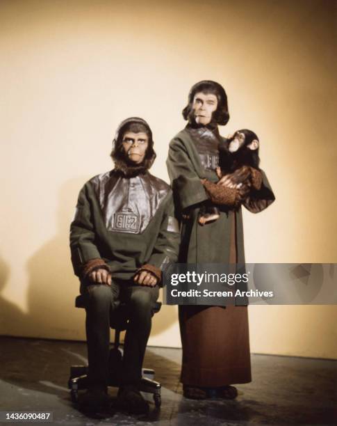 Roddy McDowall as Cornelius, and Kim Hunter as Zira pose with Baby Chimp from the 1971 movie 'Escape from the Planet of the Apes'. .