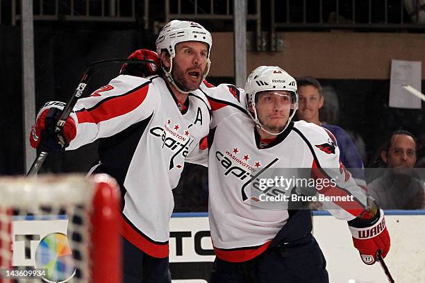 Mike Knuble oand Keith Aucoin of the Washington Capitals celebrate after Knuble scored a first period goal against the New York Rangers in Game Two...