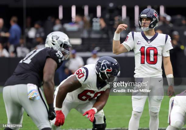 Quarterback Davis Mills of the Houston Texans prepares to run a play against the Las Vegas Raiders in the first half of their game at Allegiant...