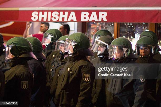 Policemen staying in front of the Shisha Bar during a Walpurgis Night demonstration on April 30, 2012 in Berlin, Germany. Police are bracing for...