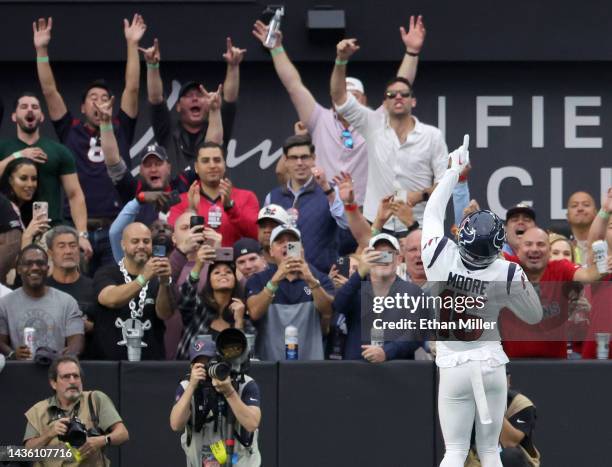 Wide receiver Chris Moore of the Houston Texans celebrates with fans behind the end zone after scoring a touchdown on a 13-yard pass play against the...