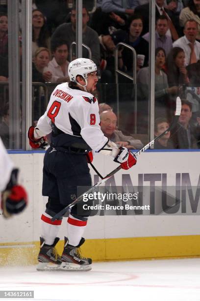 Alex Ovechkin of the Washington Capitals celebrates after he scored a goal in the third period to take a 3-2 lead against the New York Rangers in...