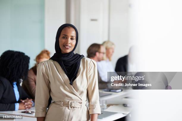 young woman at business meeting - dark skin stock pictures, royalty-free photos & images