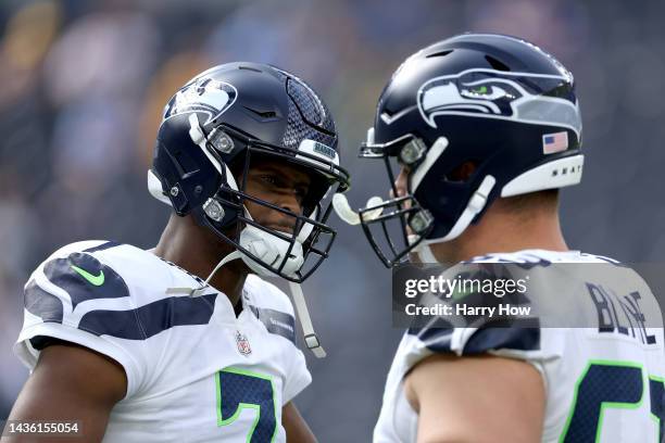 Geno Smith of the Seattle Seahawks and Austin Blythe talk during warm up before the game against the Los Angeles Chargers at SoFi Stadium on October...