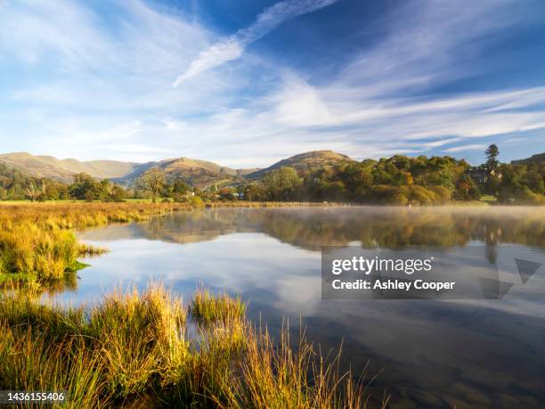mist over lake windermere, ambleside, lake district, uk, looking towards fairfield. - lake windermere stock pictures, royalty-free photos & images