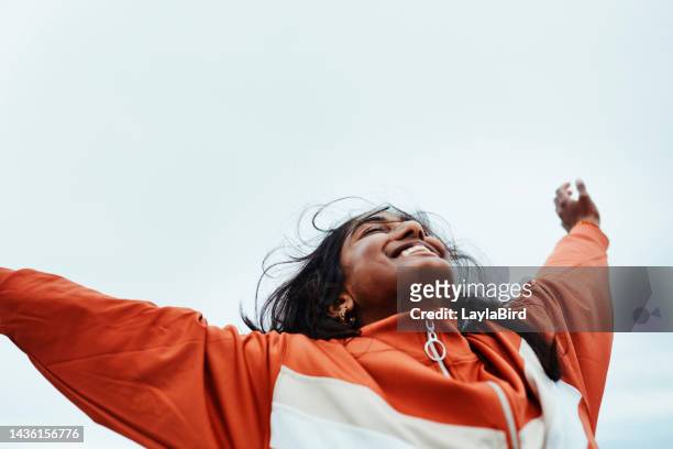 happy black woman, freedom and sky for success in adventure, travel or achievement in the outdoors. female winner celebrating goal being free in nature for successful traveling to india in happiness - utförande bildbanksfoton och bilder