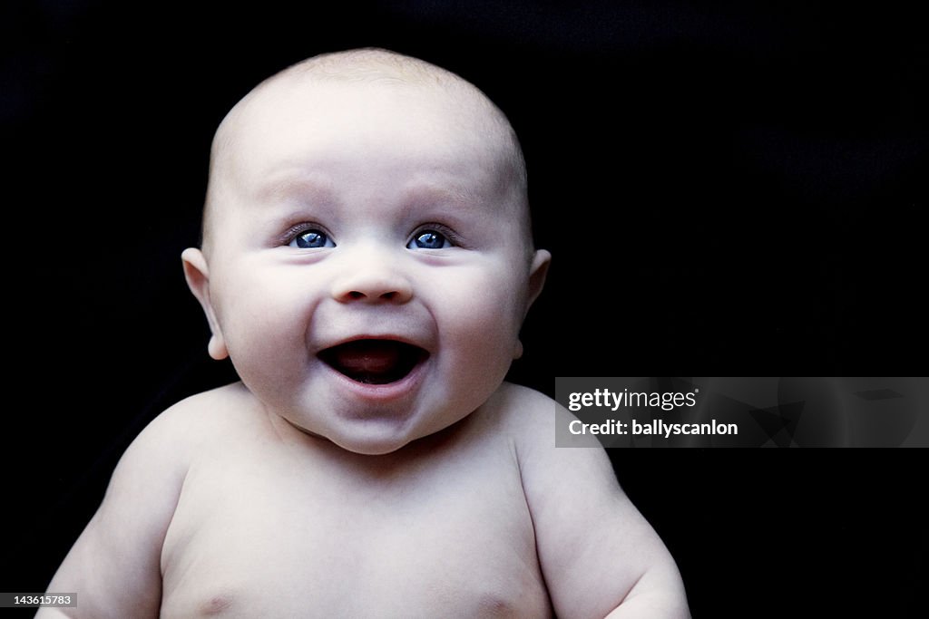 Baby on a black background.