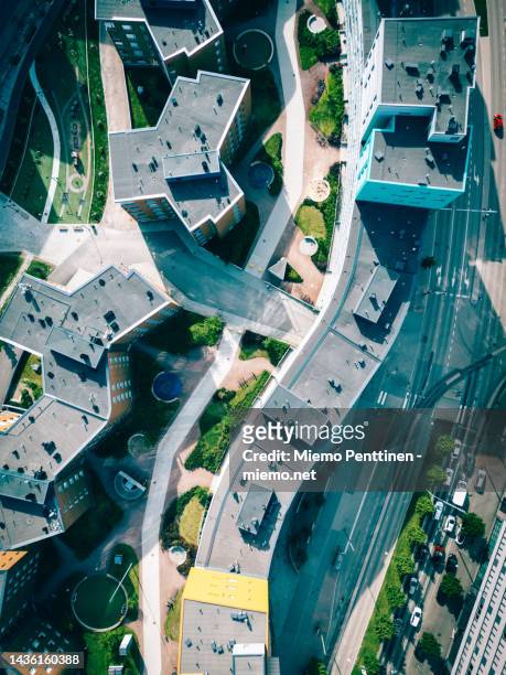 top-down aerial view into modern residential buildlings in konepaja district in downtown helsinki - helsinki stock-fotos und bilder