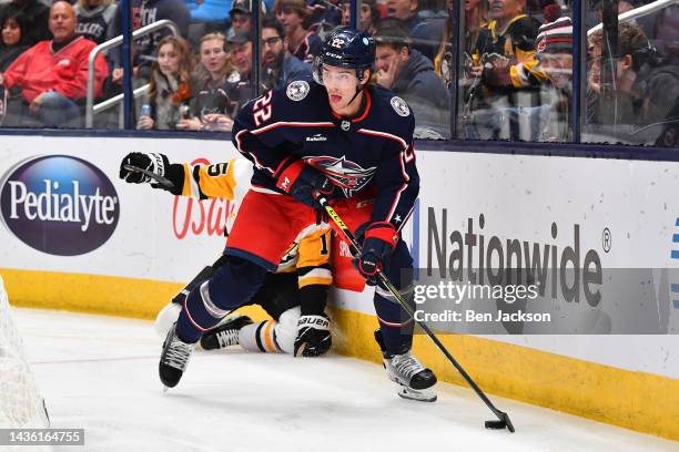 Jake Bean of the Columbus Blue Jackets skates with the puck during the first period of a game against the Pittsburgh Penguins at Nationwide Arena on...