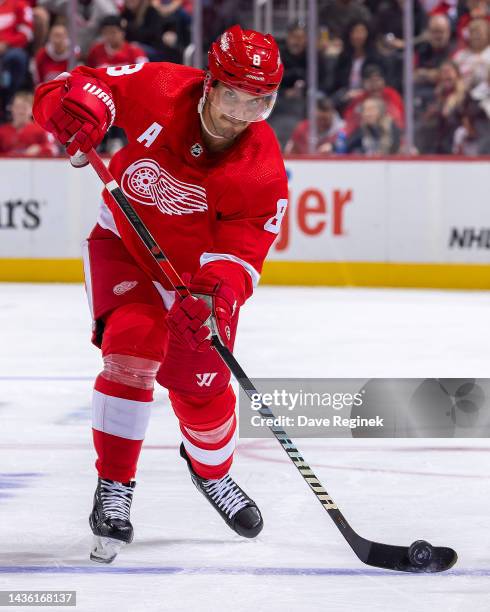 Ben Chiarot of the Detroit Red Wings shoots the puck against the Anaheim Ducks during the third period of an NHL game at Little Caesars Arena on...