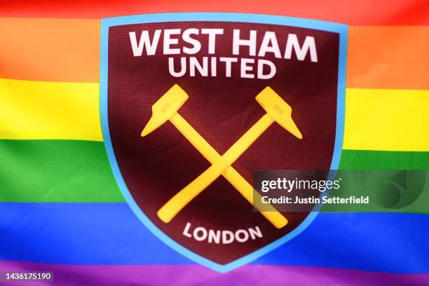 The West Ham United badge is seen printed in front of rainbow colours in support of the Stonewall Rainbow Laces campaign prior to the Premier League...